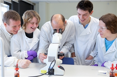Lecture and students using microscope