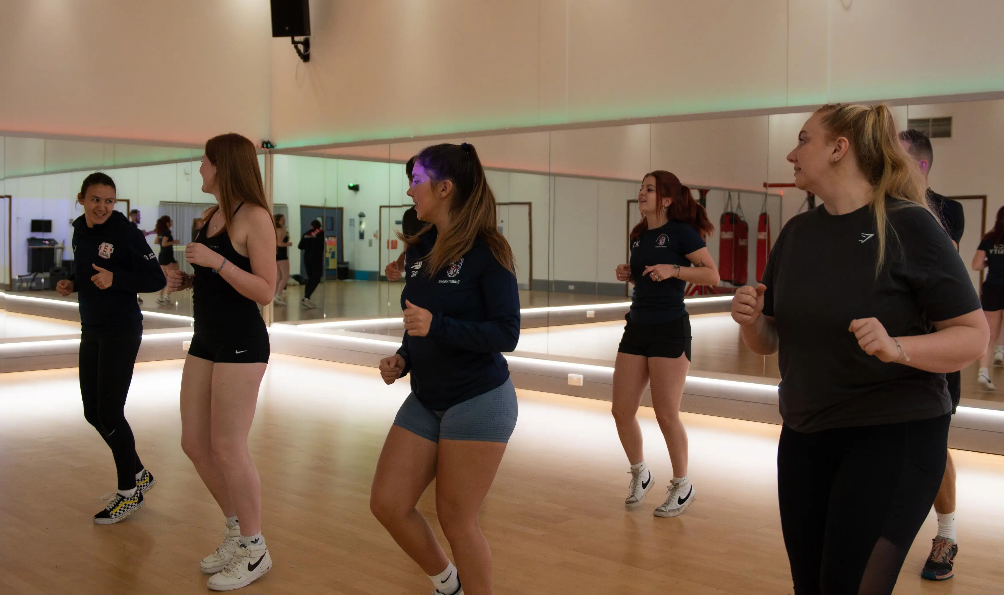 A group jogging in the fitness studio