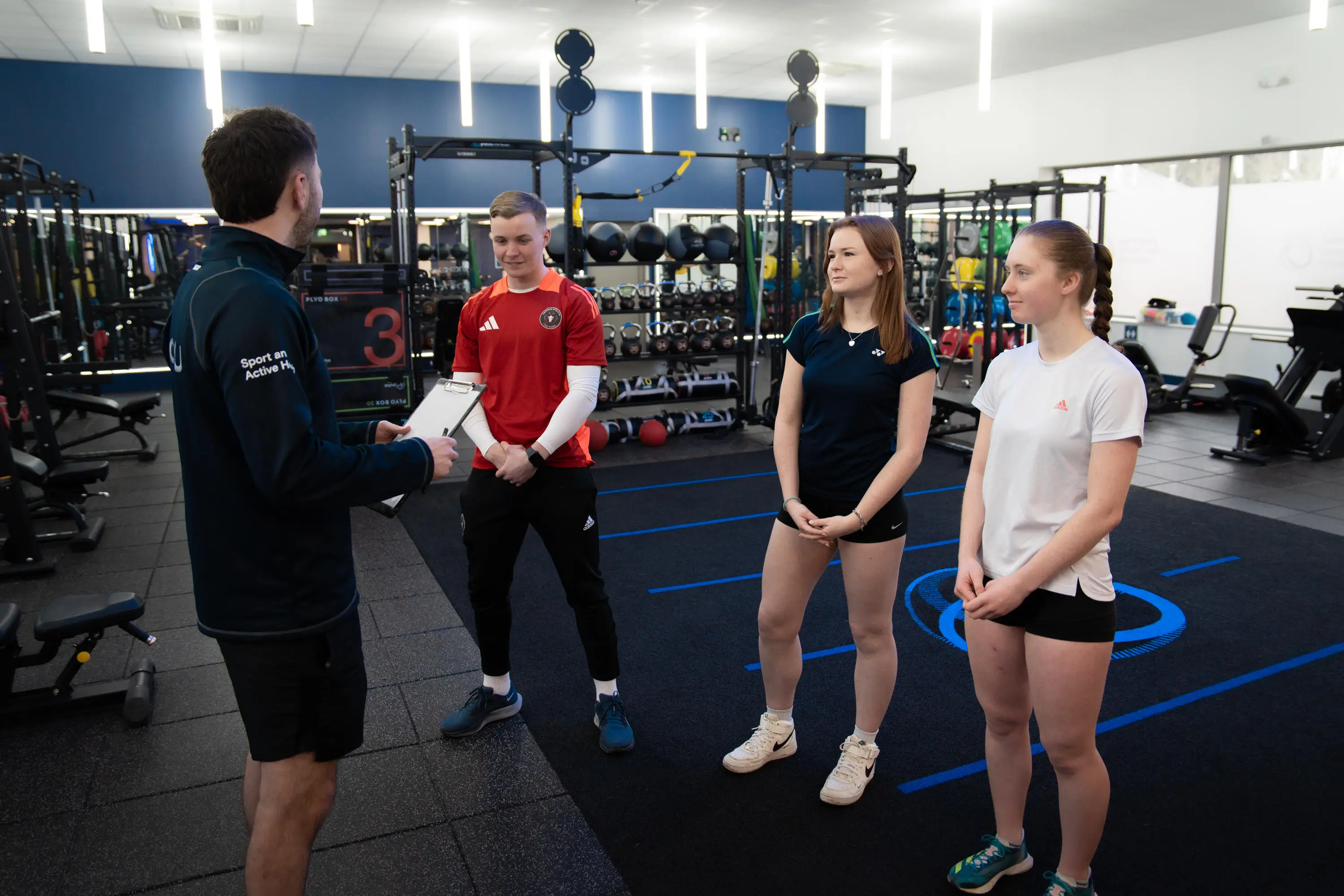 Trainer talking to a group of participants