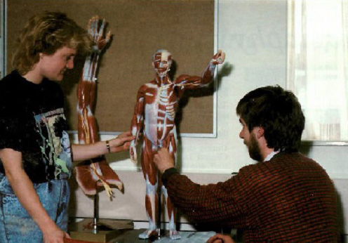 Students pictured in the 1989-90 Prospectus exploring a human anatomy model