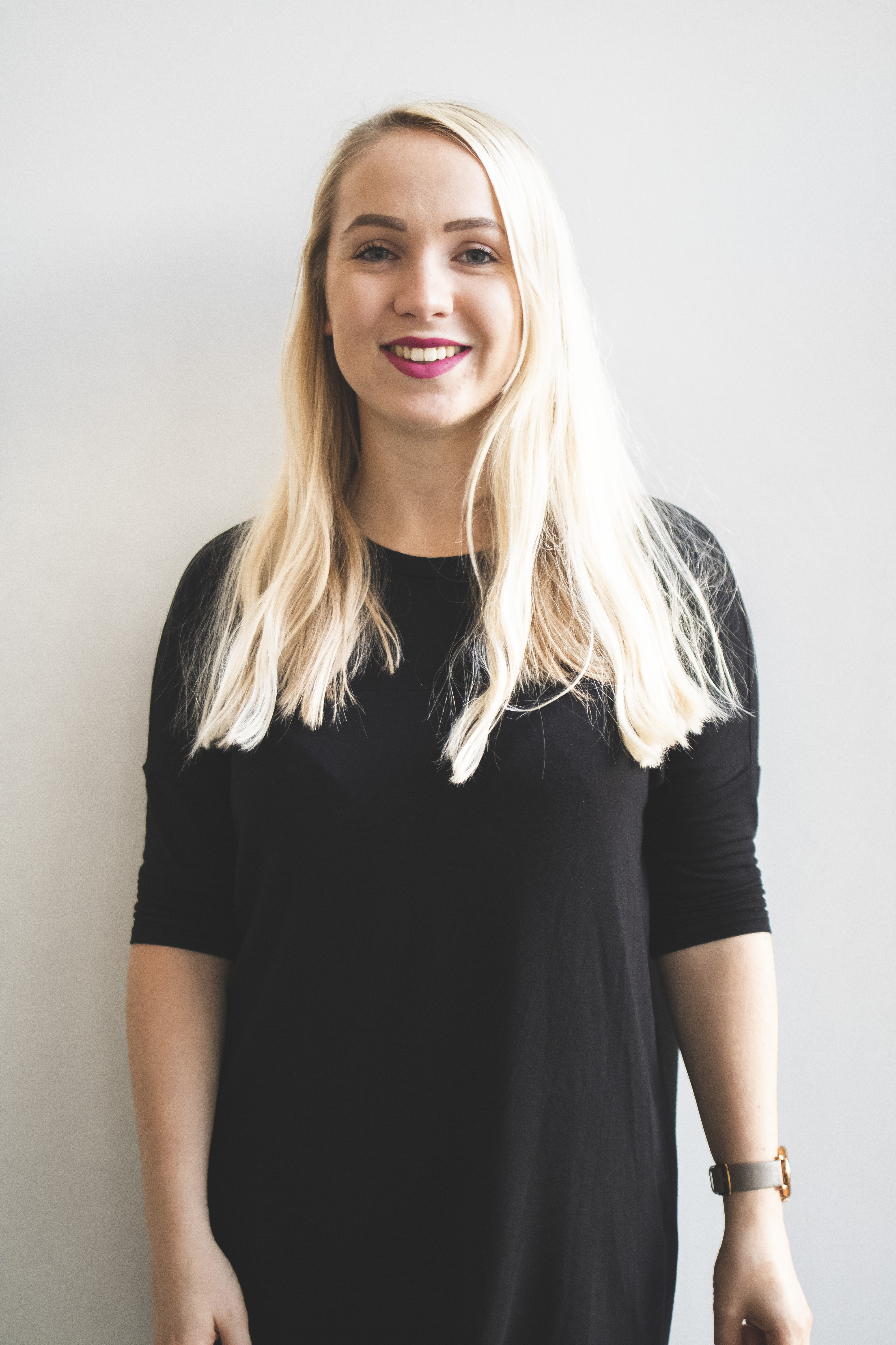 A support officer smiling at the camera.