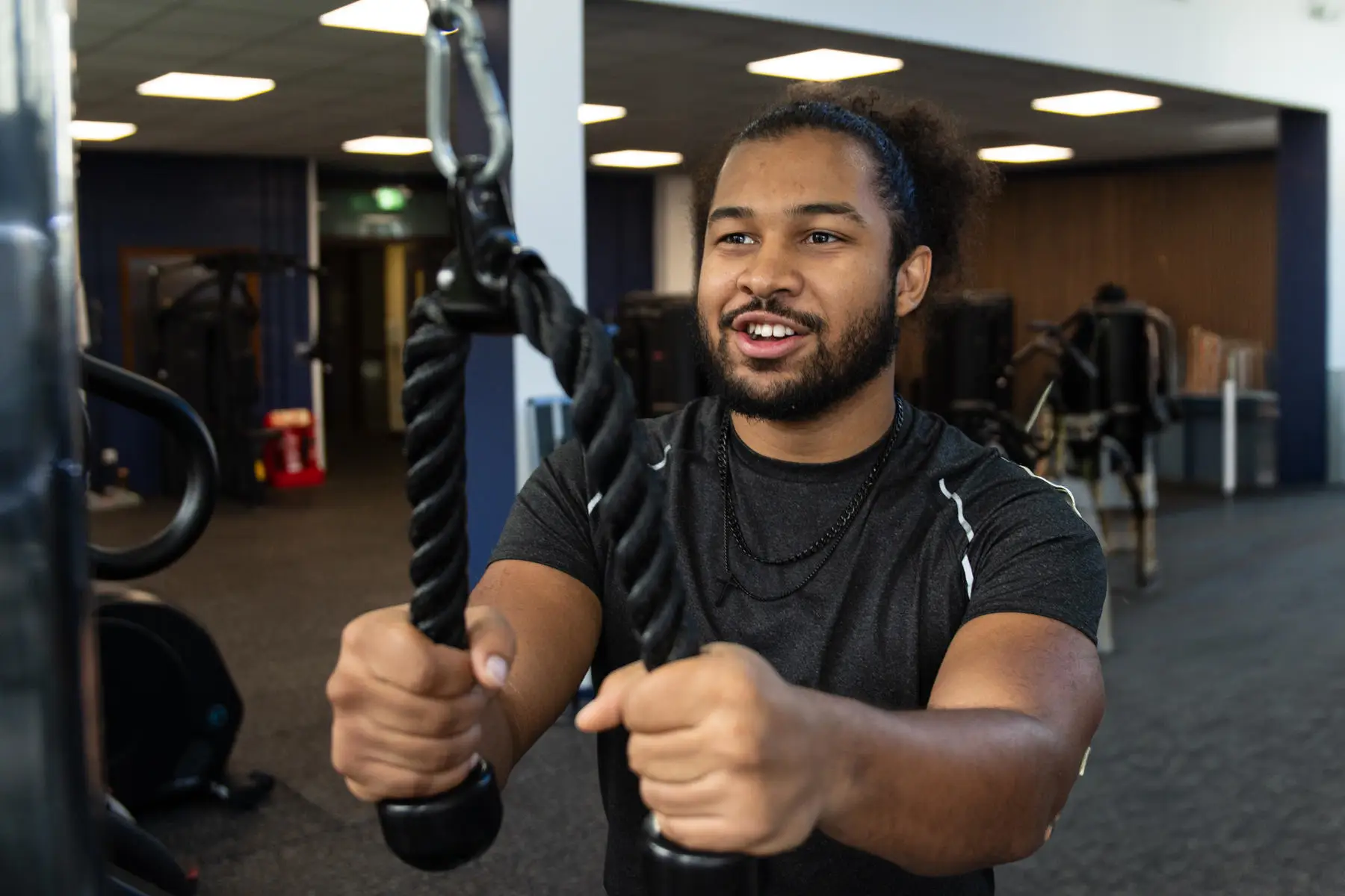 Gym user on tricep pulldown