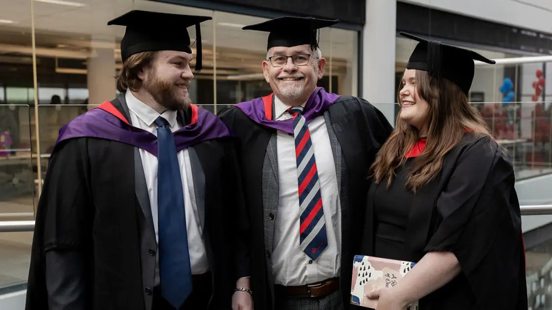 Three members of the Broadhurst family graduating together, Kyran (left), Samuel (centre), Catherine (right)
