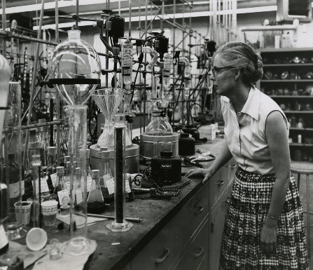 Black and white photo of lecturer in a science laboratory
