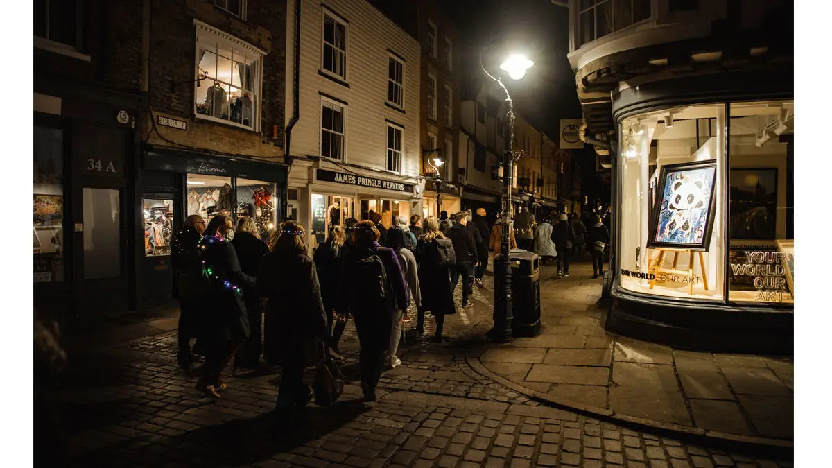 People walking through Canterbury streets for Light up the Night