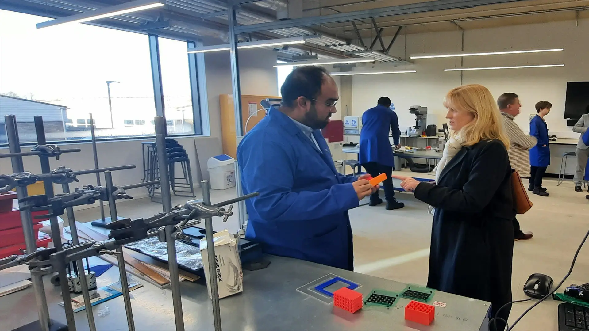 Rosie Duffield MP meets with Engineering staff in a lab looking at materials used for testing elasticity.