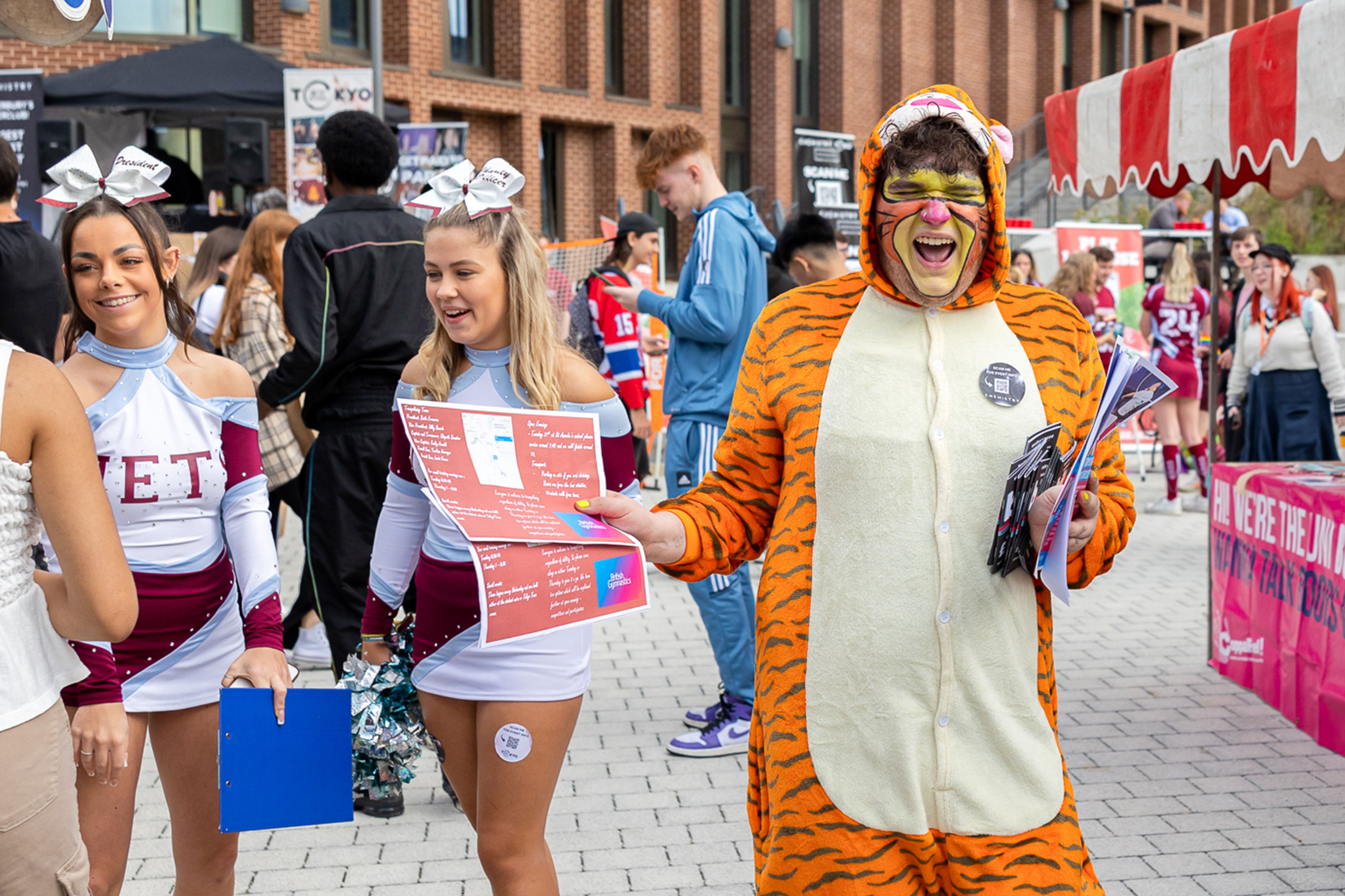 Freshers' Fayre on Canterbury Campus - a tiger handing out leaflets