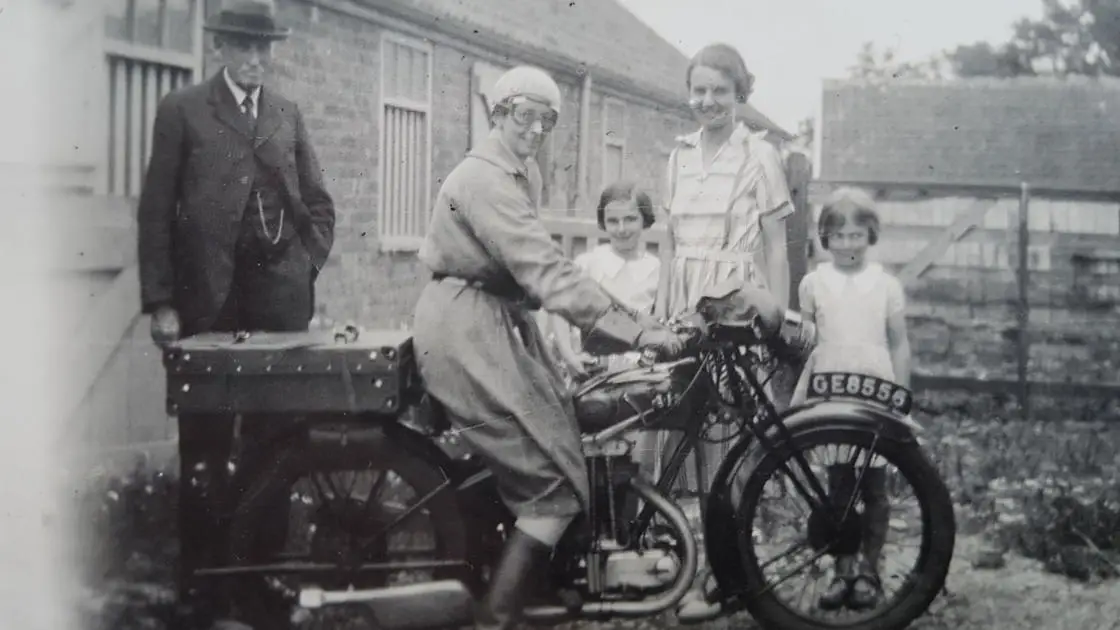 Verena Holmes on a motorbike, Nancy, Helen and Pam Johnson 1934 Pulham. Copyright Andrew Fox, Private Collection