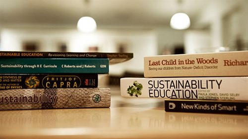 Photograph of piles of books.