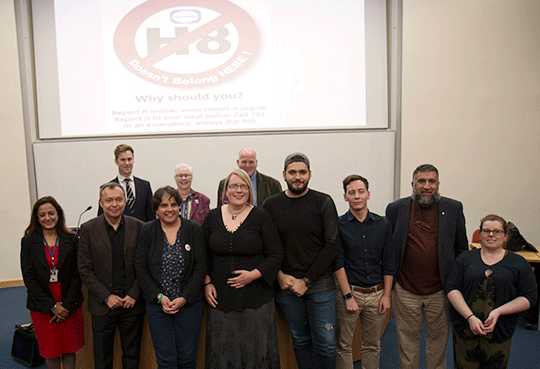 In the picture are: (l to r front row) Kulbir Pasricha, Kent Police, Prof Jon Garland, University of Surrey, Rita Chadha, Chair of Barking and Dagenham CVS, Katja Hallenberg, Senior Lecturer, CCCU, Krum Tashev, Student Union President,  Doug Little, International Partnership Co-ordinator (and CCCq co-chair) , Ajaib Hussain, Kent Muslim Welfare Association, Clara Barnes, Equality and Inclusion Manager, CCCU.   Back row (l to r) Detective Inspector Ben Loose, Kent Police, Sue Sanders, Professor Emeritus Harvey Milk Institute and Chair of Schools OUT Uk,  Paul Ginanassi, Manager of the UK Government Hate Crime Programme.